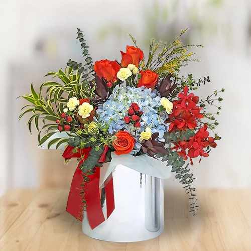 Vibrant Blue, Orange & Yellow Bloom Arrangement For Singapore Celebrations